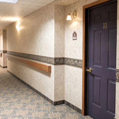 A hallway in a rehabilitation center with a purple door labeled 